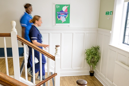 MSI UK nurses walking down stairs.