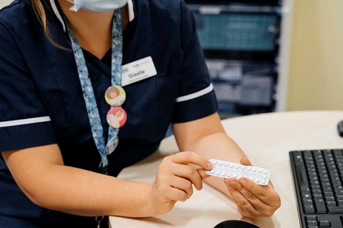 MSI UK nurse showing contraceptive pill.