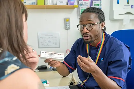 MSI UK nurse showing contraceptive implant.