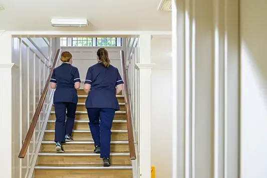 Nurses walking up stairs of abortion clinic
